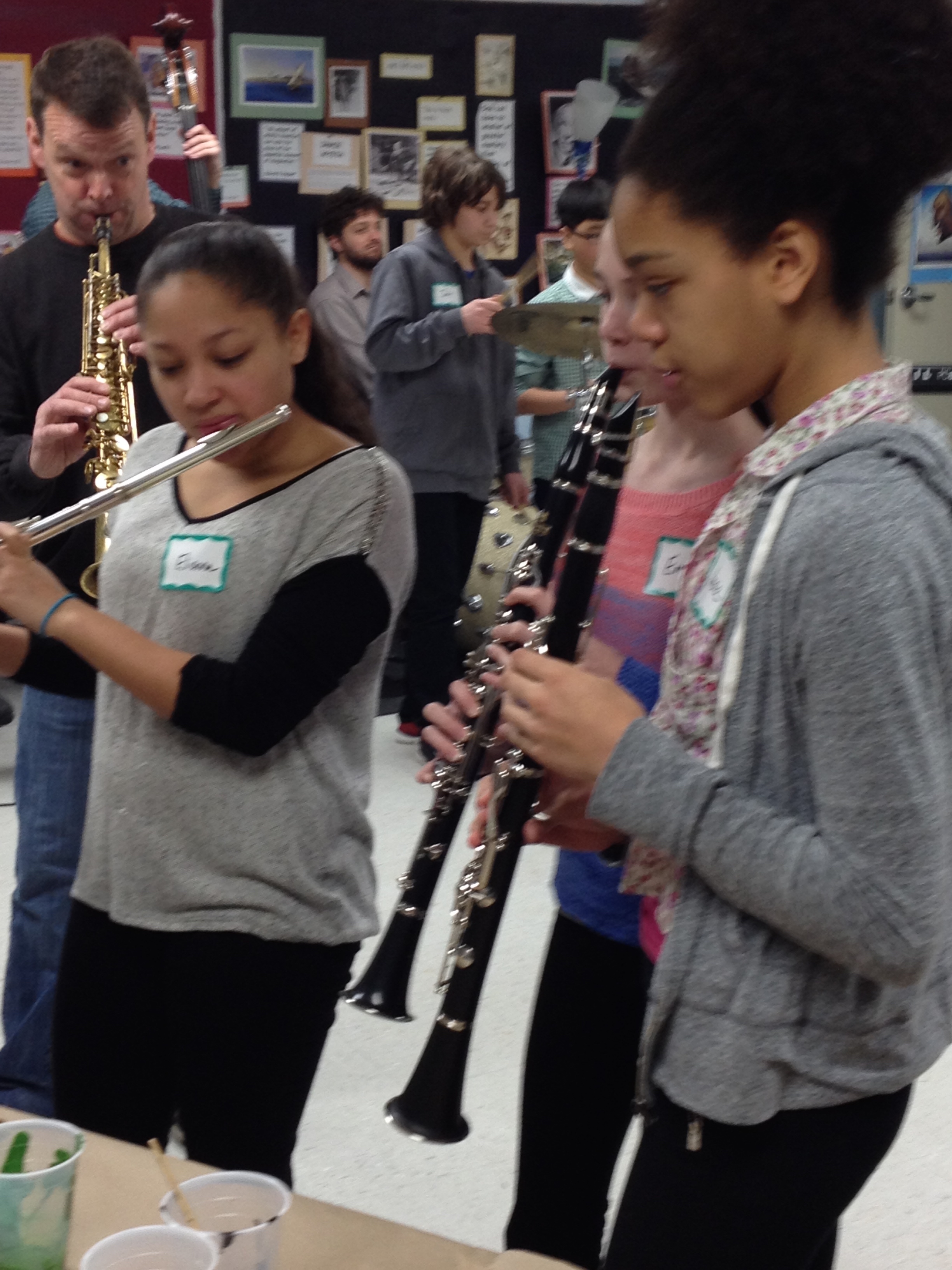 Woodwinds jam with the visual jazz painters as Matt Langley leads on his Soprano Saxophone in the background