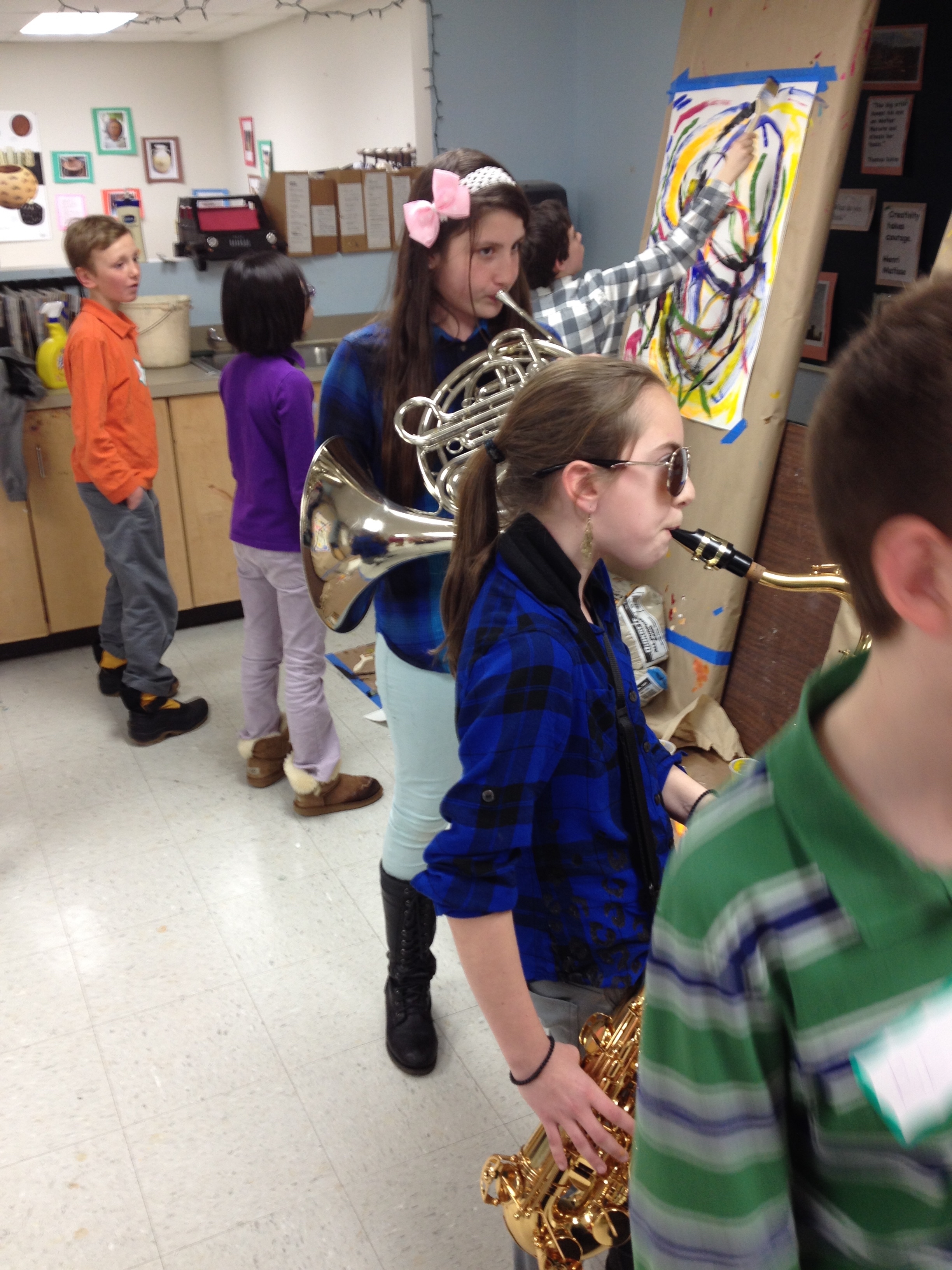 Six grade jazz students wade right into the visual jazz conversation, approaching each painter with call and response